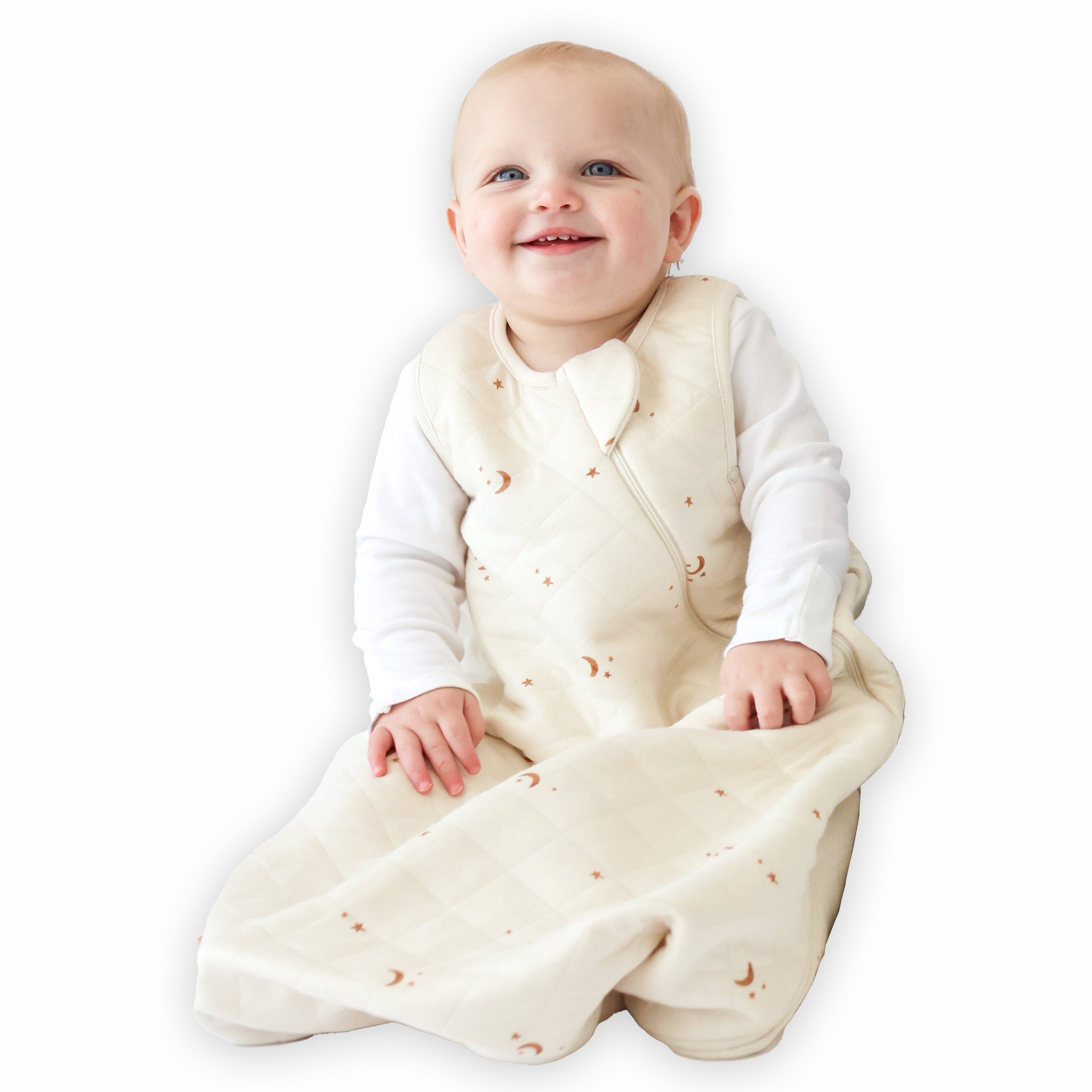 A baby sitting down comfortably in a Tealbee Dreambag 1.2 TOG, highlighting the perfect combination of warmth, coziness, and freedom of movement for a happy, restful sleep.