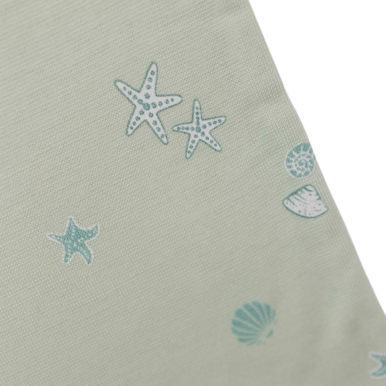 Fabric close up of tealbee pajamas in seashell print