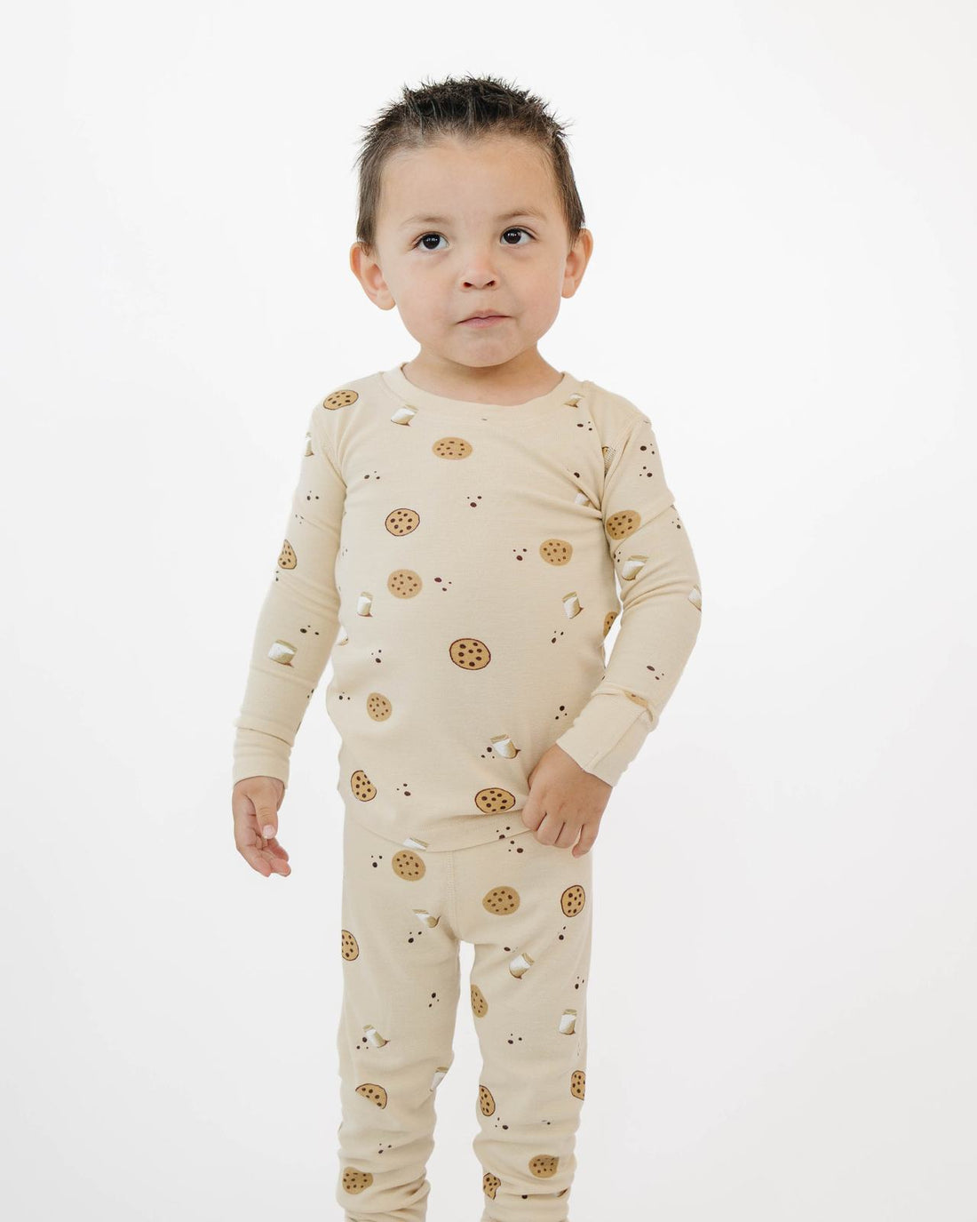 Toddler standing in Cookies pajamas, showing the fit