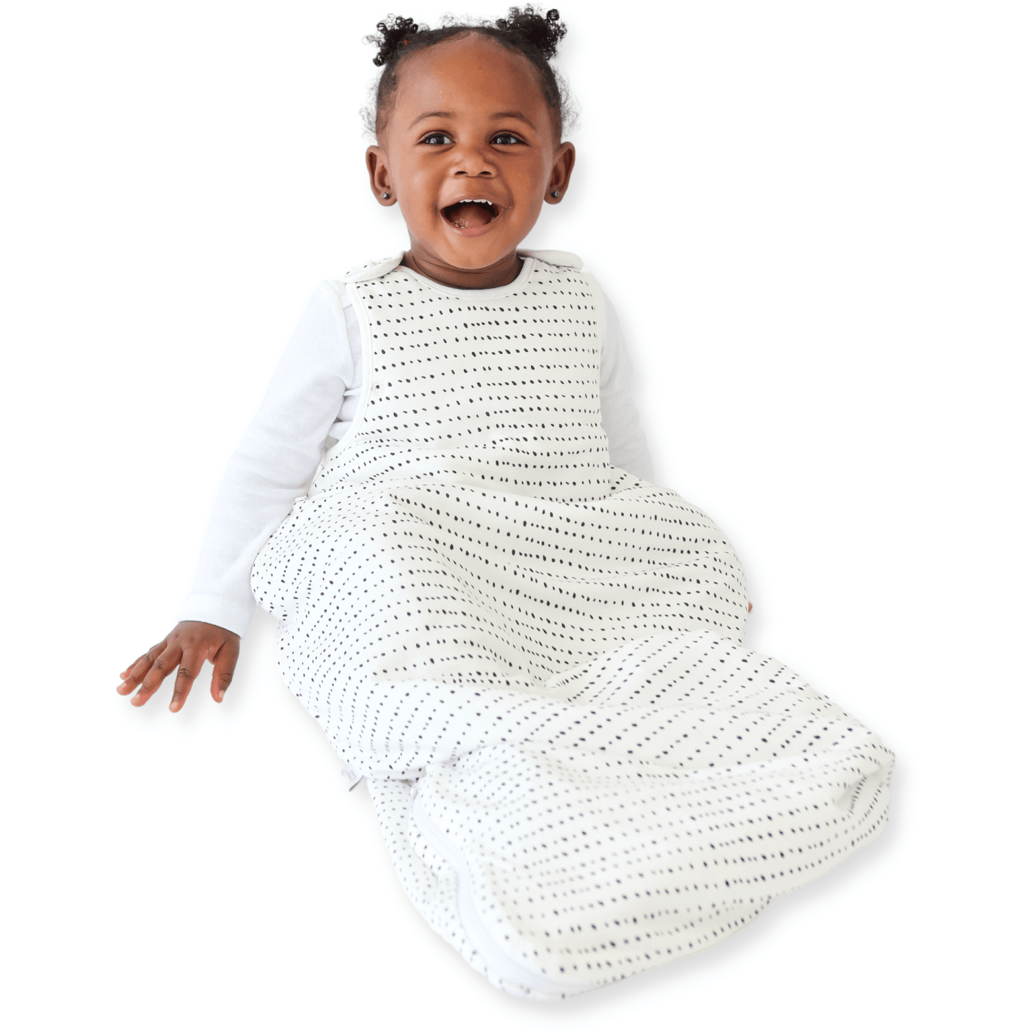 A baby sitting down comfortably in a Tealbee Dreambag 1.5 TOG, highlighting the perfect combination of warmth, coziness, and freedom of movement for a happy, restful sleep.