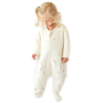 A baby standing up comfortably in a Tealbee Dreamsie, highlighting the perfect combination of warmth, coziness, and freedom of movement for a happy, restful sleep.